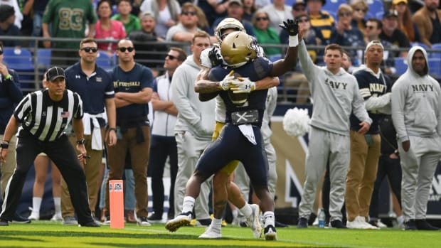 Notre Dame wide receiver Braden Lenzy catches a ball over the back of a Navy cornerback for a touchdown.